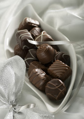 chocolate candy decorated on silk close up shoot