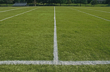 White boundary lines of American football playing field.