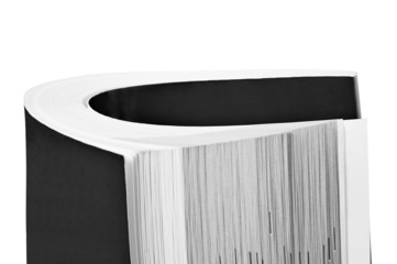 Rolled up black book isolated on white background