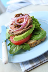Open roast beef sandwich, with avocado.