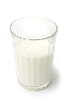 Milk in the glass on white background. Food image series
