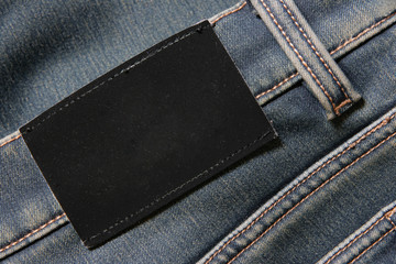 Jeans with blank black label - put your own text here