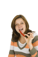 Woman eating pepperoni.