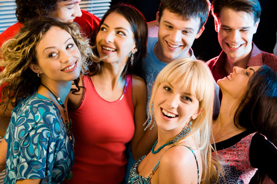 Happy group of people having an evening-party