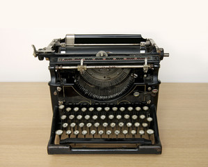 Retro typewriter on a desk - space for text above