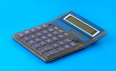 A small calculator, isolated on blue background.