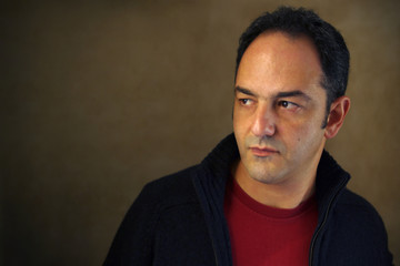 Portrait of a man in serene expression looking to his right side