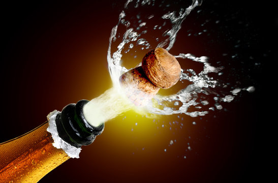 Close up of champagne cork popping