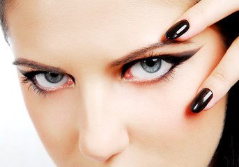 Fashion style. Woman face with so sexy "black eyes"
