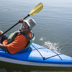 Happy man kayaking.