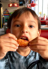 boy eating chicken wings - 5378390