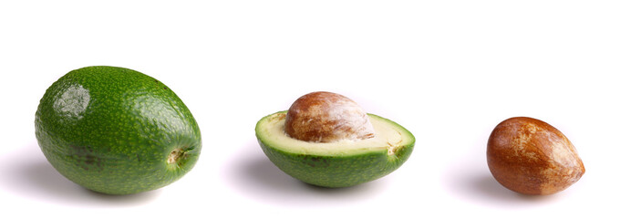 whole and half avocados isolated on white background