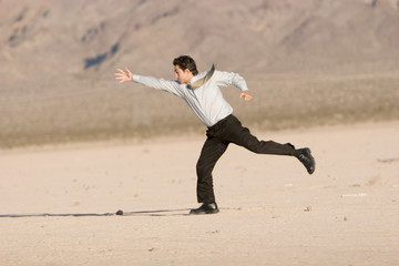 Young businessman reaching for success