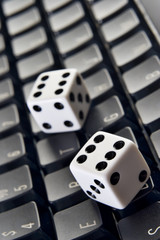 Dice on a computer keyboard