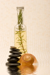 Obraz na płótnie Canvas Essential oils and massage stones