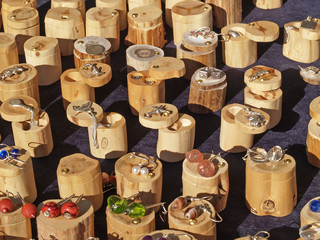 Silver jewelry in small wooden boxes, close-up