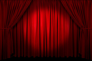 Large red curtain with spot light and fading into dark. - 5388768