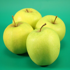 Apples  on a green background.
