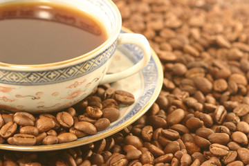 Cup of coffee with beans