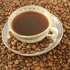 Cup of coffee with beans