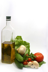 Olive oil in bottle,parsley, tomatom, mushroom,cucumber, fennel