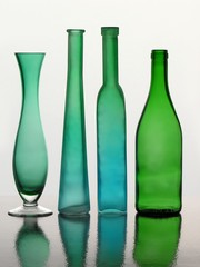 green glass vases and bottles
