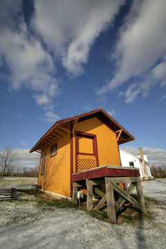 Extreme Wide Angle Shot Of Yellow Cabin In Winter Time