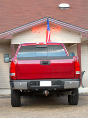 A red pickup truck outside a carry out restaurant © David Smith