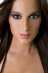 Fototapeta premium stunning brunette face with dark makeup and pink lips
