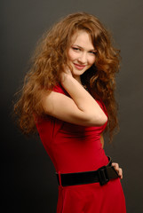 Fototapeta premium The beautiful girl in a red dress