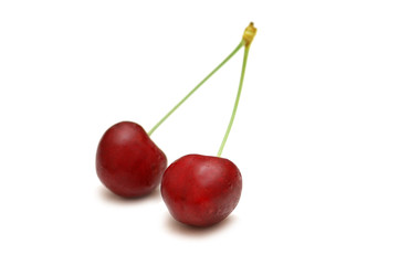 Two cherries isolated on the white background