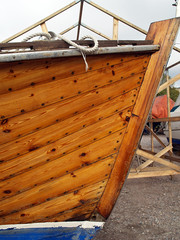 Front of big wooden rowing boat, close-up