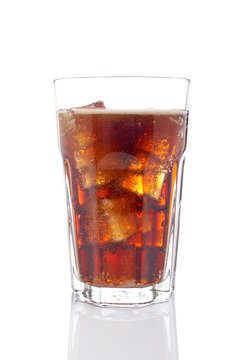 A soda drink glass with ice cubes, reflected on white background