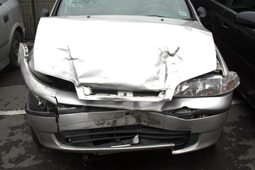 a car which is damaged in a car crush it is nearly destroy.