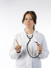 cute brunette in white medical gown   and a stethoscope