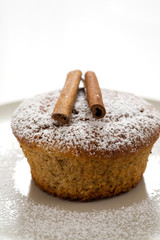 Gingerbread muffin decorated with cinnamon sticks