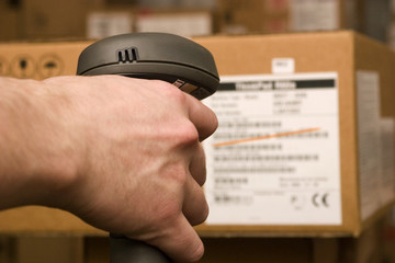 Barcode scaner is in the hands of man