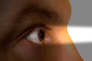 Human eye and light beam