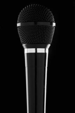 a black microphone against black background