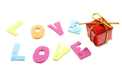 Love letters and a gift box isolated over white