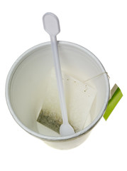 Tea bag in a disposable cup isolated on white background..