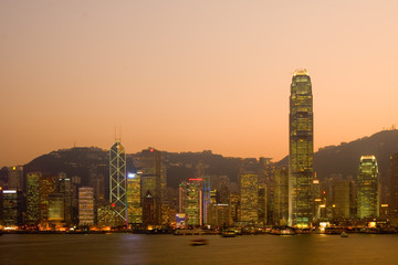 Skyline of Victoria Harbour in Hong Kong at dusk..