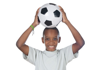 young cute boy holding a soccer ball over his head