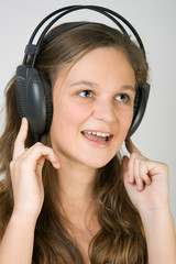 Fototapeta premium Young pretty girl singing.