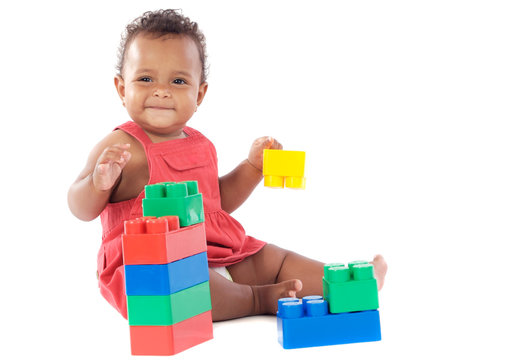 Baby Girl Playing With Building Blocks Over White Background