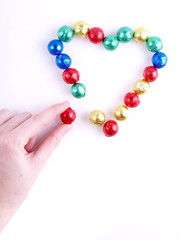 Pralines in the colorful paper/ sweet heart