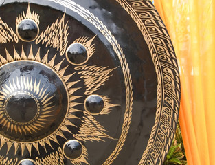 Gong and yellow cloth at a Buddhist temple in Thailand