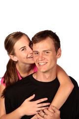 Young lady whispering something into partners ear