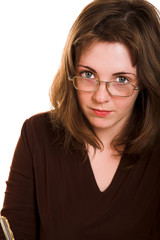 Fototapeta premium Young woman in glasses with pen in her hand
