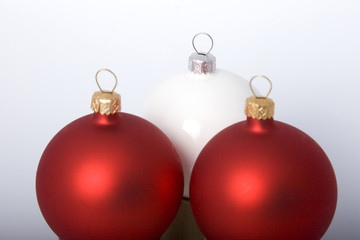 Christmas baubles, bows and garland on background